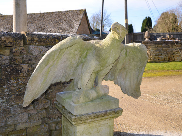 A pair of impressive carved stone eagles