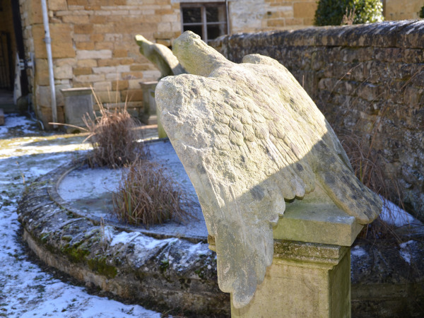 A pair of impressive carved stone eagles