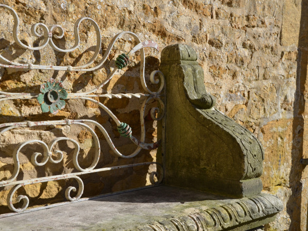 An early 20th century carved limestone garden seat