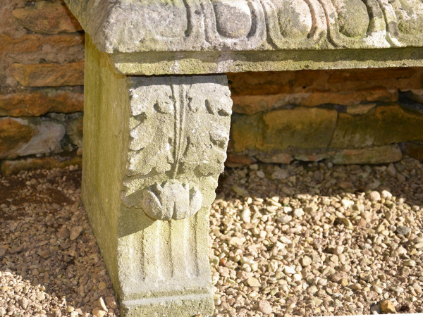 An early 20th century carved limestone garden seat