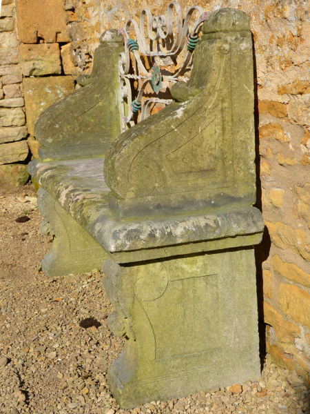 An early 20th century carved limestone garden seat