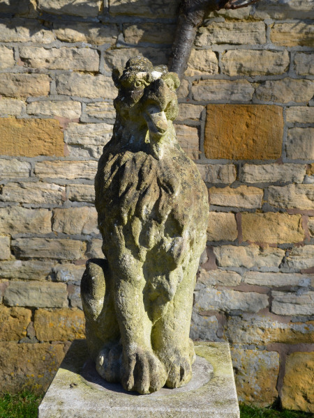 A pair of 19th century carved Bath stone griffins