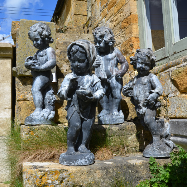 A set of four large lead Seasons