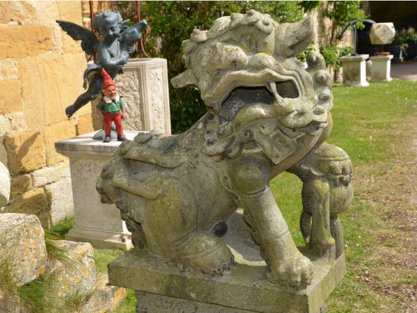 A pair of late 19th century Japanese carved granite Dogs of Foo