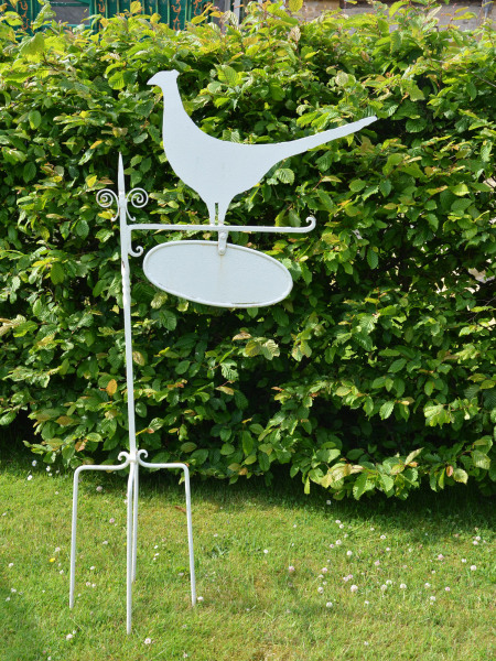 A Folk Art iron house sign with pheasant silhouette