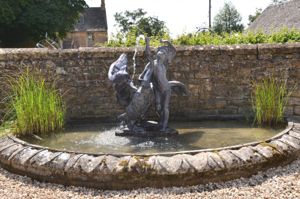 A mid 20th century lead fountain of 'A Boy with Swan' after the model by Theodore Kalide (1801 -1863)