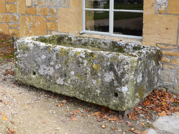 A large antique limestone trough with good weathering and patination