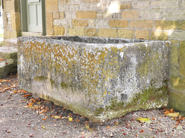 A large antique limestone trough with good weathering and patination