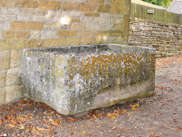 A large antique limestone trough with good weathering and patination