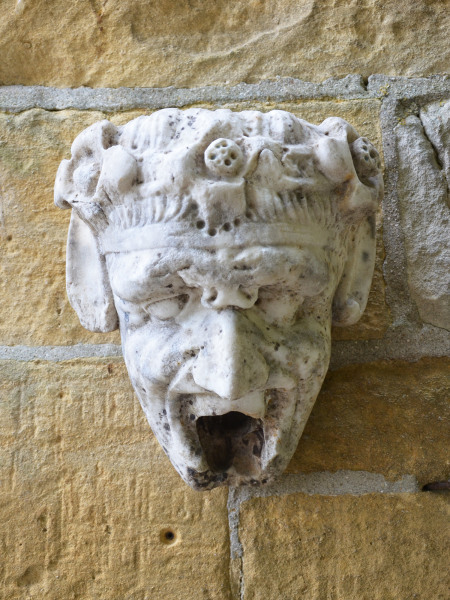 A 19th century Italian marble water spout in the form of Pan