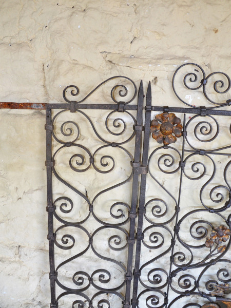 A pair of early 20th century Continental wrought iron and toll work garden gates