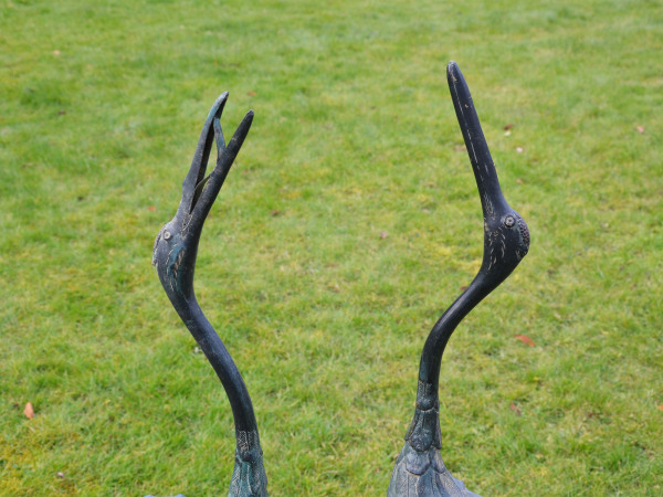 A pair of Japanese Taisho period (1912-1926) bronze cranes