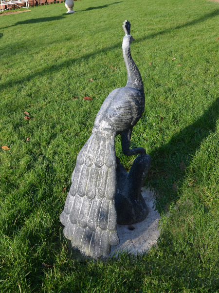 A mid 20th century cast zinc peacock