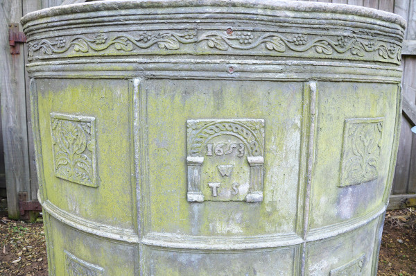 A semi-circular lead cistern Dated 1653